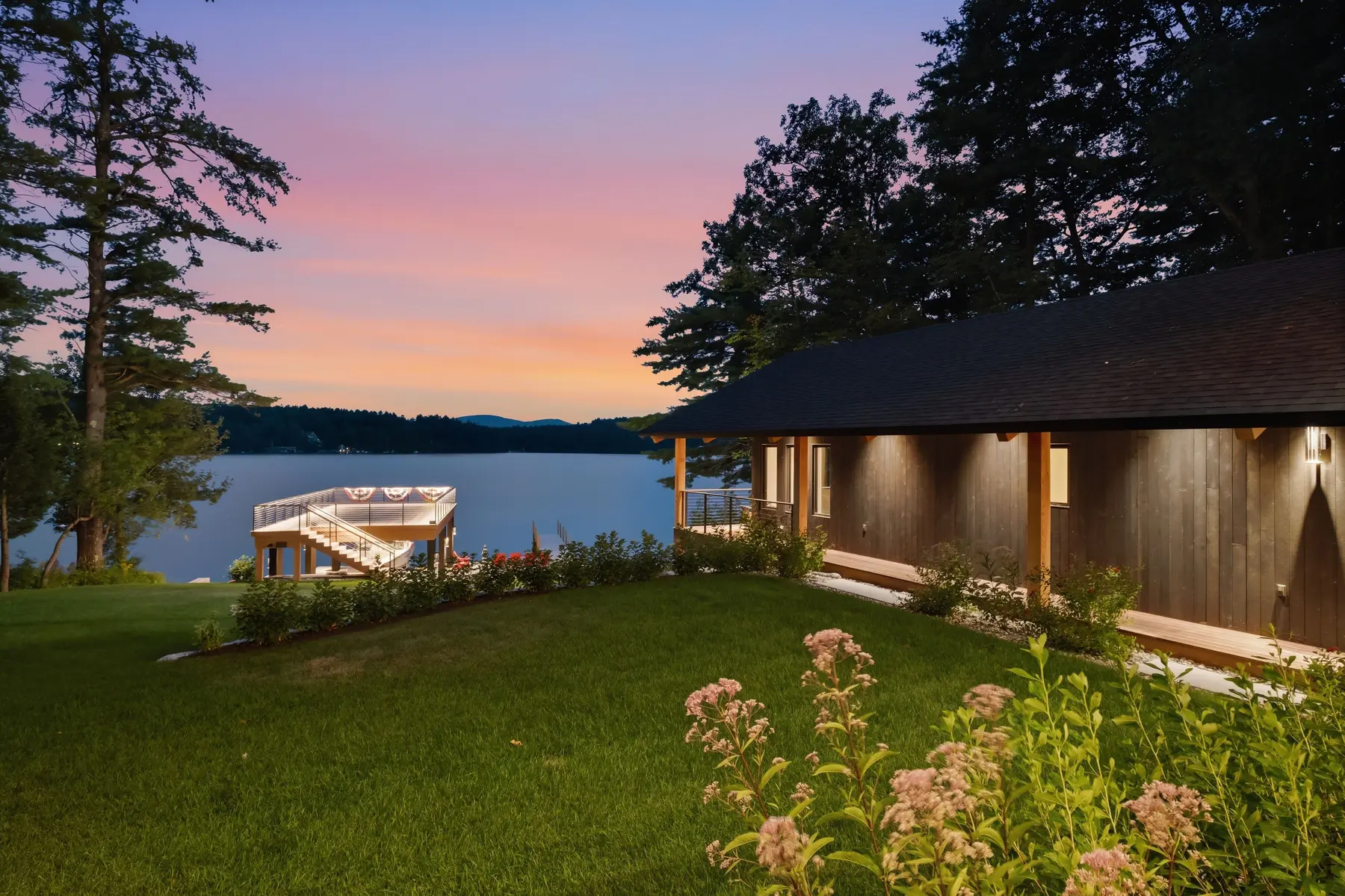 Twilight view of a Winter Harbor waterfront residence