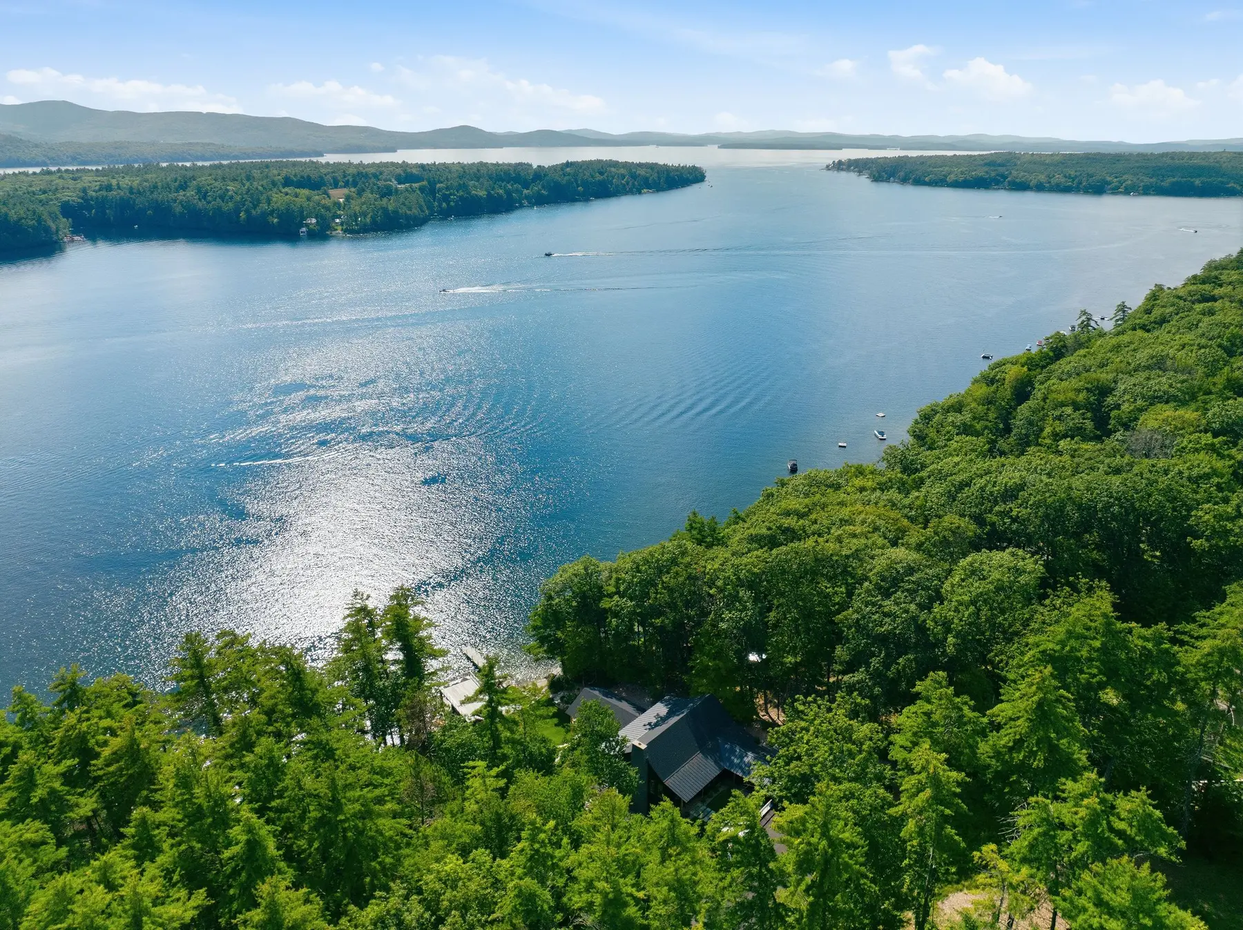 Aerial view of Lake Winnipesaukee and private shoreline